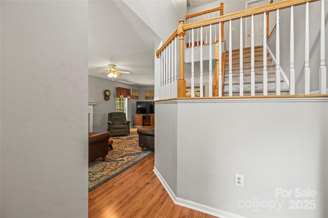171 Highland Woods Ct, Denver, NC 28037 - stairway featuring wood finished floors and a ceiling fan