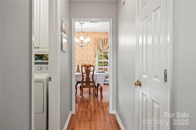 171 Highland Woods Ct, Denver, NC 28037 - corridor featuring a chandelier, light wood-style flooring, and washer / dryer