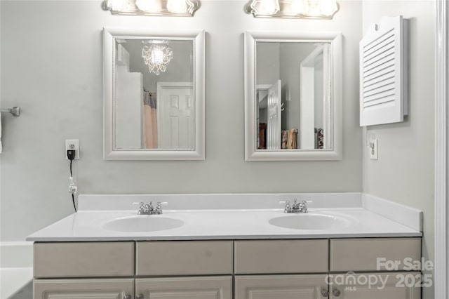 171 Highland Woods Ct, Denver, NC 28037 - bathroom with double vanity and a chandelier
