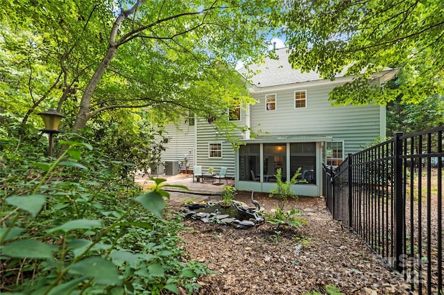 171 Highland Woods Ct, Denver, NC 28037 - back of house with a sunroom, a patio area, and roof with shingles