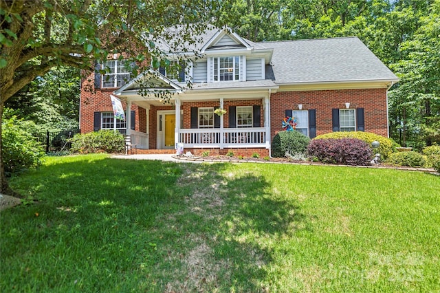 171 Highland Woods Ct, Denver, NC 28037 - view of front of home with a porch, brick siding, a front lawn, and roof with shingles