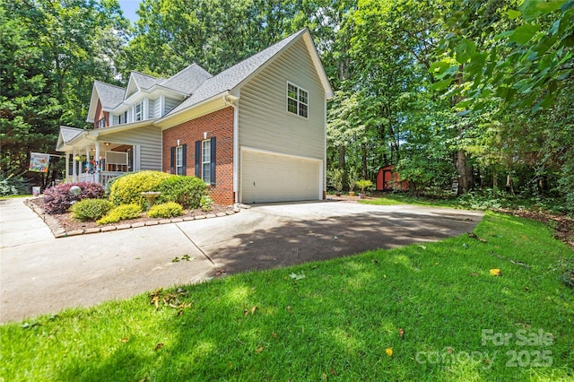 171 Highland Woods Ct, Denver, NC 28037 - view of home's exterior with asphalt driveway, brick siding, a garage, a yard, and a storage unit