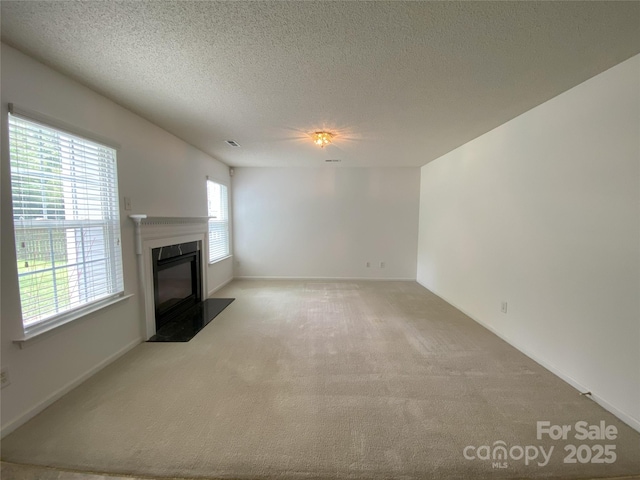 3933 Cameron Creek Dr, Matthews, NC 28105 - unfurnished living room with carpet floors, a fireplace with flush hearth, and a textured ceiling