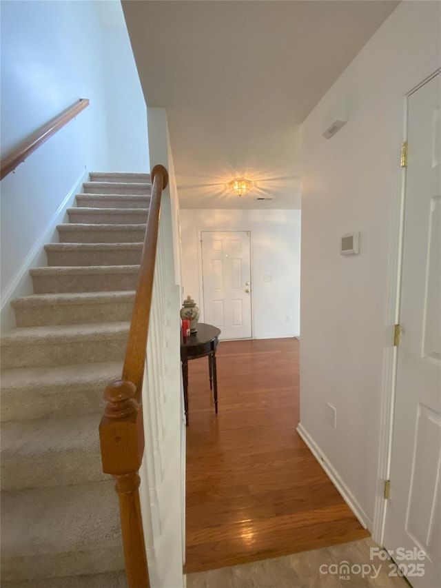 3933 Cameron Creek Dr, Matthews, NC 28105 - staircase with wood finished floors and baseboards