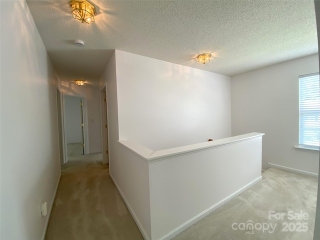 3933 Cameron Creek Dr, Matthews, NC 28105 - hallway with light carpet, an upstairs landing, and a textured ceiling