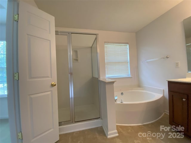 3933 Cameron Creek Dr, Matthews, NC 28105 - bathroom featuring vanity, a shower stall, a garden tub, and tile patterned flooring