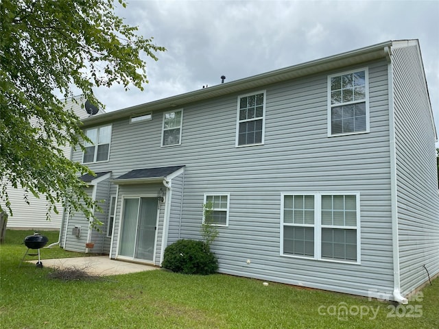 3933 Cameron Creek Dr, Matthews, NC 28105 - rear view of property featuring a lawn and a patio area