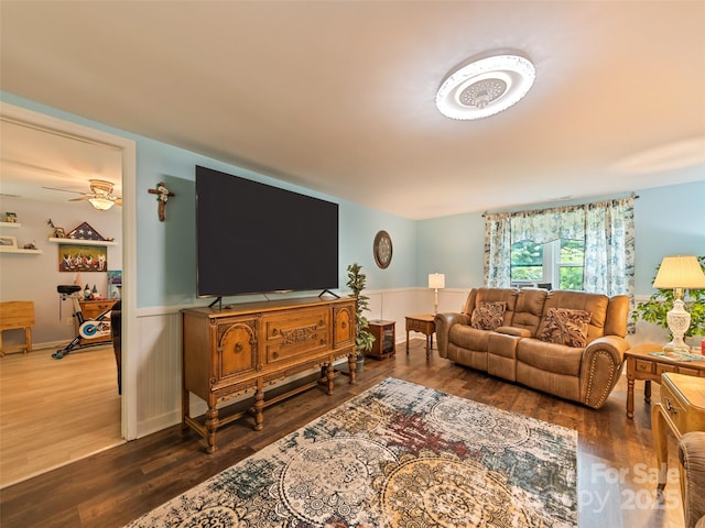 449 Little E Fork Rd, Canton, NC 28716 - living area with wood finished floors, a ceiling fan, and wainscoting