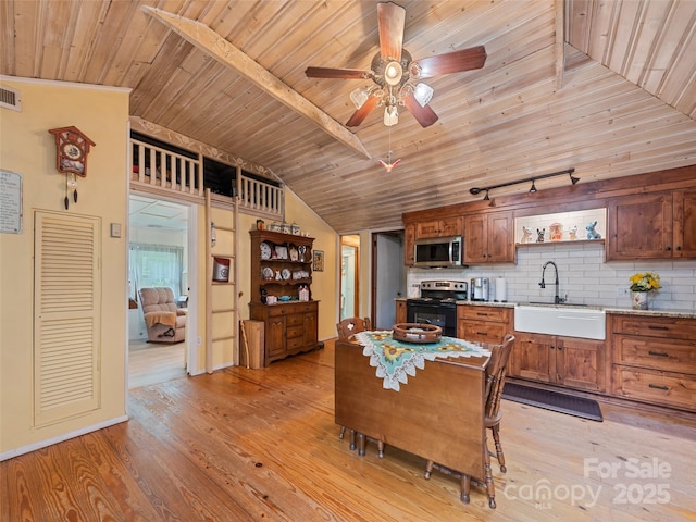 449 Little E Fork Rd, Canton, NC 28716 - kitchen featuring black range with electric cooktop, stainless steel microwave, brown cabinets, open shelves, and wooden ceiling