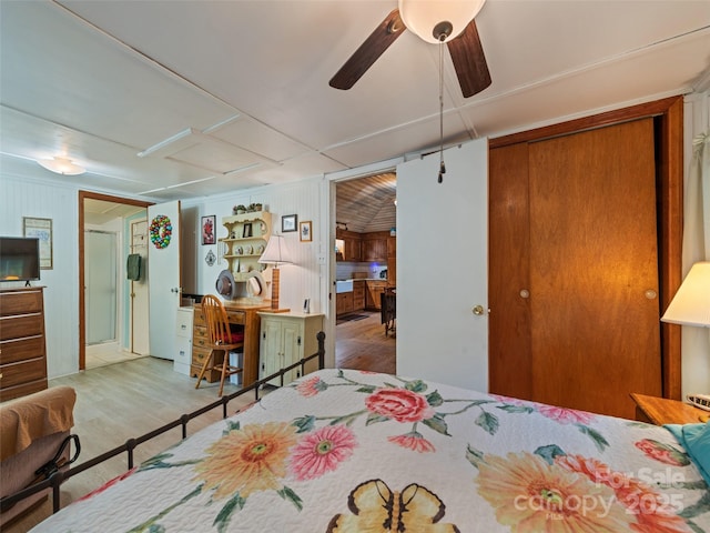 449 Little E Fork Rd, Canton, NC 28716 - bedroom with wood finished floors, a ceiling fan, and wooden walls