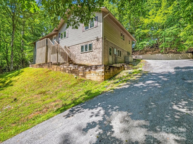 436 Utsonati Ln, Brevard, NC 28712 - view of home's exterior with stairway and stone siding