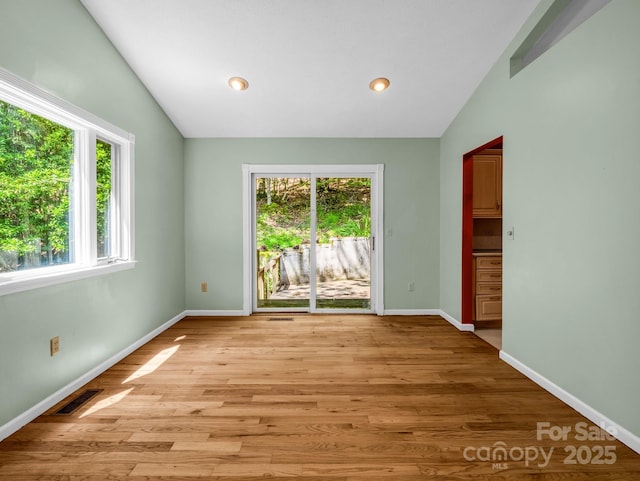 436 Utsonati Ln, Brevard, NC 28712 - empty room featuring lofted ceiling, light wood-style floors, and recessed lighting