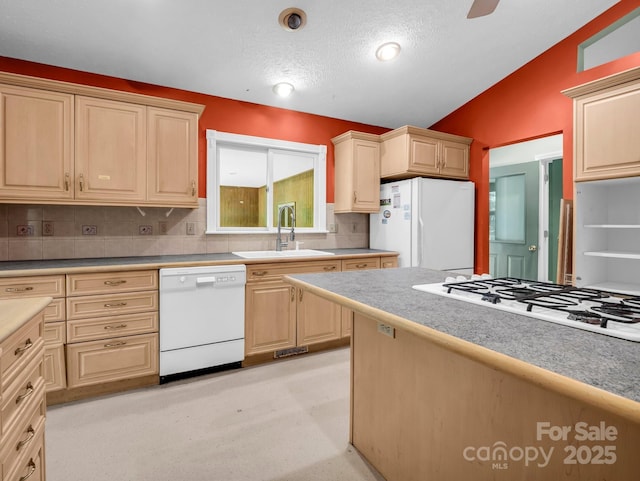 436 Utsonati Ln, Brevard, NC 28712 - kitchen with white appliances, vaulted ceiling, light countertops, decorative backsplash, and a textured ceiling