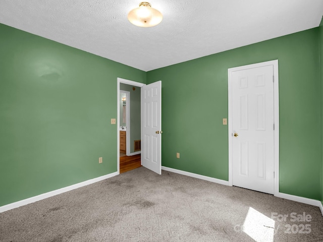 436 Utsonati Ln, Brevard, NC 28712 - unfurnished bedroom with carpet and a textured ceiling
