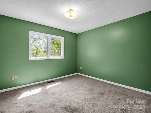 436 Utsonati Ln, Brevard, NC 28712 - carpeted spare room featuring baseboards and a textured ceiling