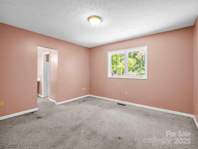 436 Utsonati Ln, Brevard, NC 28712 - carpeted spare room featuring baseboards and a textured ceiling