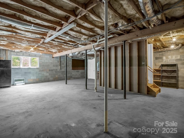 436 Utsonati Ln, Brevard, NC 28712 - below grade area featuring stairway and freestanding refrigerator