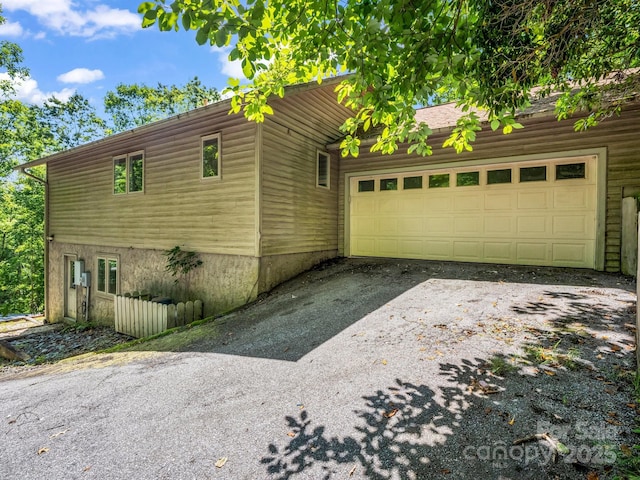 436 Utsonati Ln, Brevard, NC 28712 - view of home's exterior with asphalt driveway and a garage