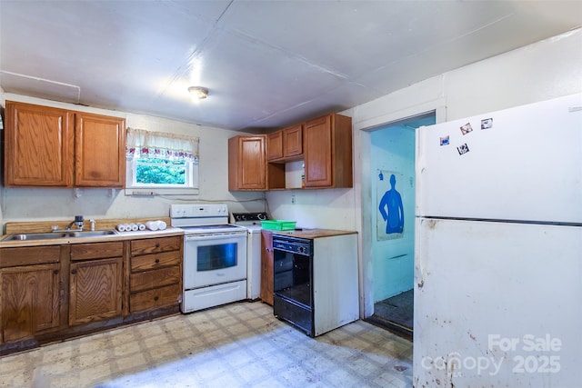 121 Sugar Cove Rd, Weaverville, NC 28787 - kitchen with white appliances, light floors, brown cabinetry, and light countertops