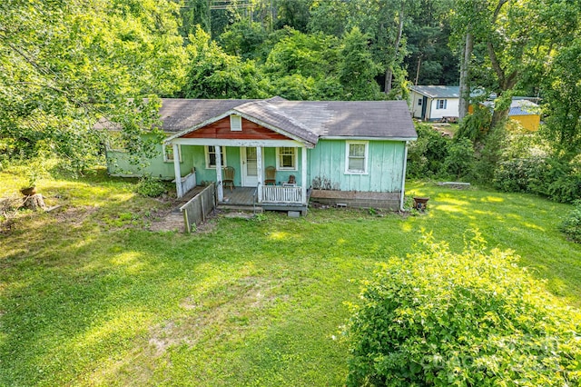 121 Sugar Cove Rd, Weaverville, NC 28787 - bungalow-style home with covered porch, a front yard, and roof with shingles