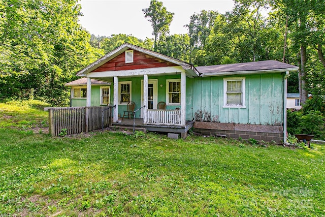 121 Sugar Cove Rd, Weaverville, NC 28787 - view of front of home featuring covered porch, a front lawn, and board and batten siding