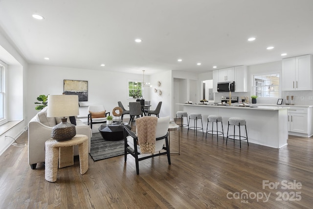 5817 Red Carriage Ln, Charlotte, NC 28212 - living room featuring plenty of natural light, recessed lighting, and dark wood-style flooring