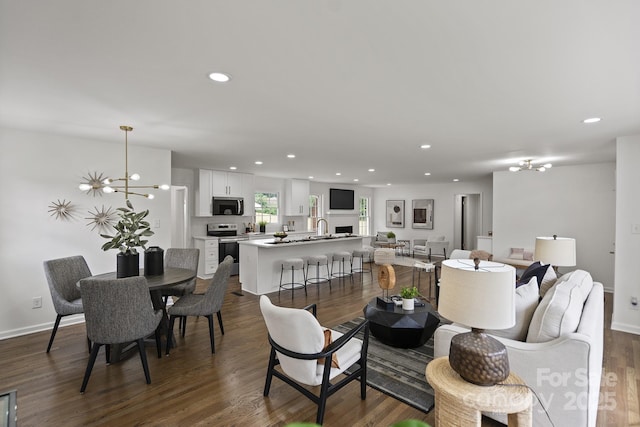 5817 Red Carriage Ln, Charlotte, NC 28212 - living room featuring a chandelier, recessed lighting, and dark wood-style flooring