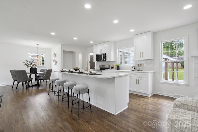 5817 Red Carriage Ln, Charlotte, NC 28212 - kitchen with stainless steel appliances, healthy amount of natural light, white cabinetry, and recessed lighting