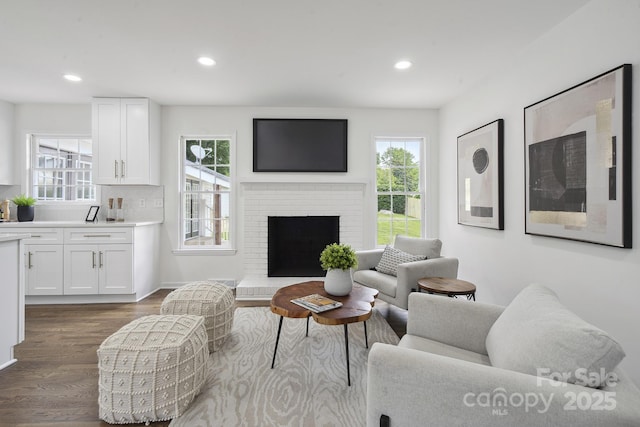 5817 Red Carriage Ln, Charlotte, NC 28212 - living area featuring dark wood-type flooring, healthy amount of natural light, recessed lighting, and a brick fireplace