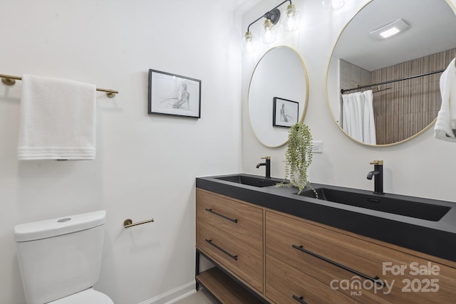 5817 Red Carriage Ln, Charlotte, NC 28212 - bathroom with double vanity and a shower with curtain