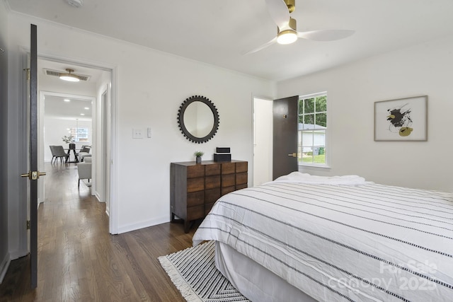 5817 Red Carriage Ln, Charlotte, NC 28212 - bedroom with dark wood finished floors and ornamental molding