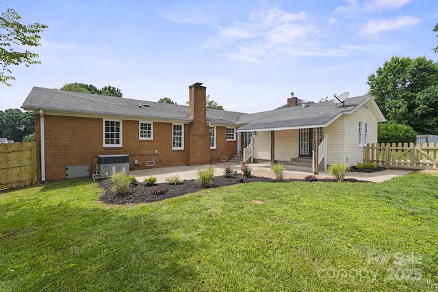 5817 Red Carriage Ln, Charlotte, NC 28212 - rear view of house with entry steps, a chimney, brick siding, and a patio