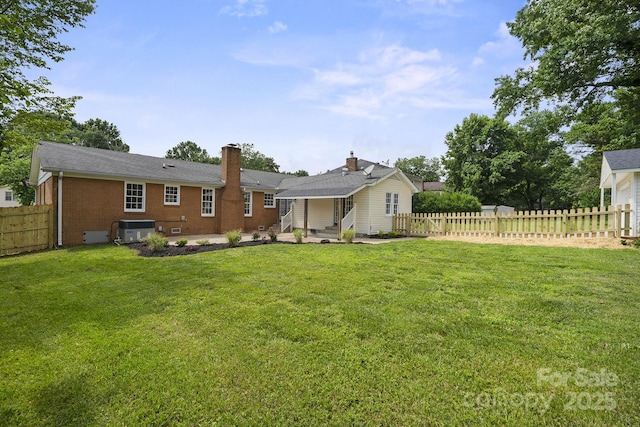 5817 Red Carriage Ln, Charlotte, NC 28212 - rear view of property with a fenced backyard, brick siding, a patio, a chimney, and entry steps