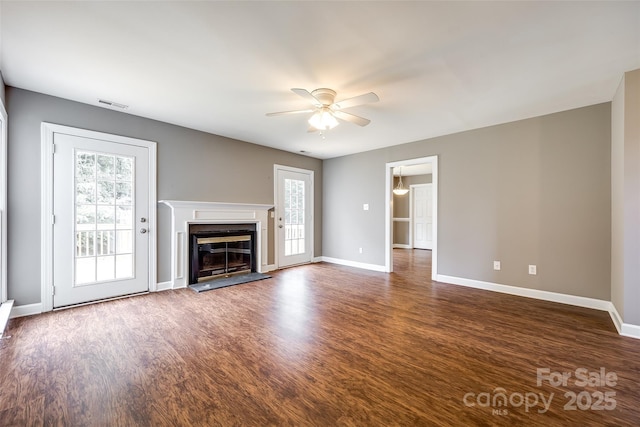 12812 Bradford Hill Ln, Huntersville, NC 28078 - unfurnished living room featuring ceiling fan, dark wood finished floors, and a glass covered fireplace