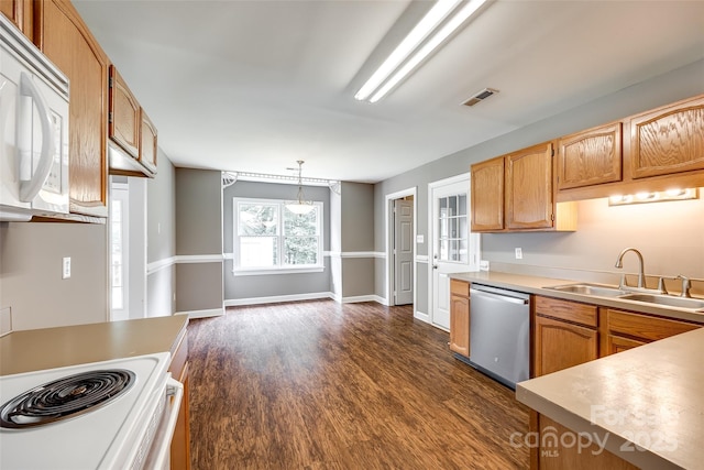 12812 Bradford Hill Ln, Huntersville, NC 28078 - kitchen featuring white appliances, dark wood-type flooring, decorative light fixtures, and light countertops