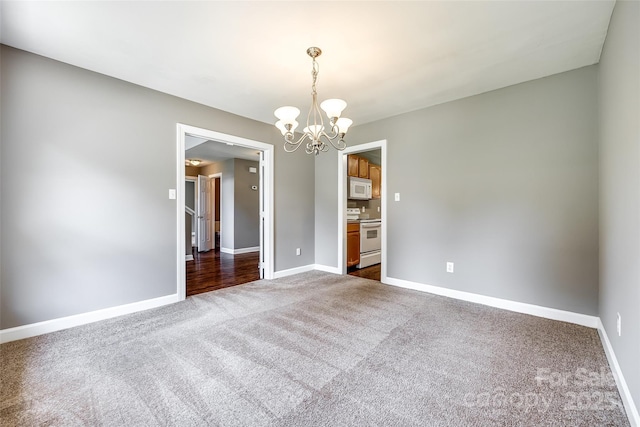 12812 Bradford Hill Ln, Huntersville, NC 28078 - unfurnished room with dark carpet and a chandelier