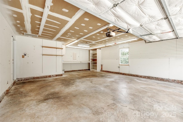 12812 Bradford Hill Ln, Huntersville, NC 28078 - garage featuring a garage door opener and baseboards