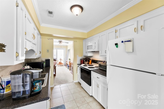 1670 Robins Nest Ct Unit C, Gastonia, NC 28054 - kitchen with white appliances, dark countertops, white cabinets, crown molding, and a ceiling fan