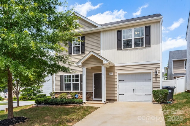 2005 Amos Oaks Ln, Charlotte, NC 28215 - traditional-style house featuring an attached garage and driveway