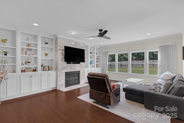 2100 Darian Way, Waxhaw, NC 28173 - living area featuring a high end fireplace, ceiling fan, dark wood-style floors, ornamental molding, and recessed lighting