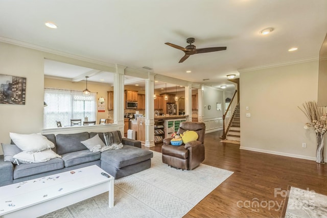 2100 Darian Way, Waxhaw, NC 28173 - living room with ornate columns, ceiling fan, ornamental molding, wood finished floors, and stairway