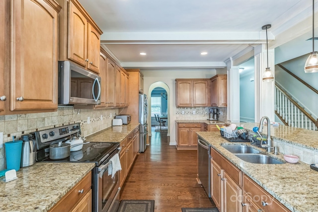 2100 Darian Way, Waxhaw, NC 28173 - kitchen with appliances with stainless steel finishes, arched walkways, light stone counters, backsplash, and recessed lighting