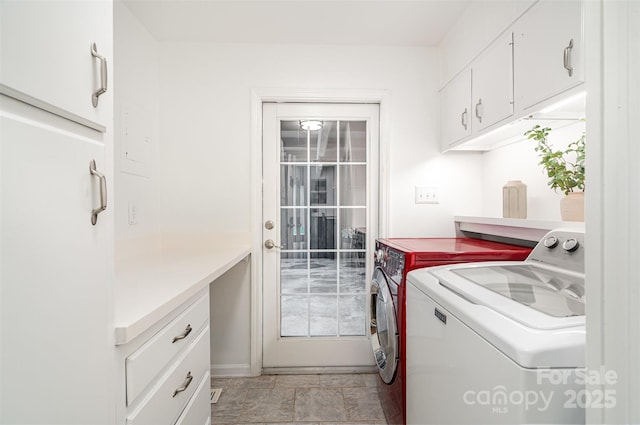 4725 Rounding Run Rd, Charlotte, NC 28277 - laundry room featuring washing machine and dryer, cabinet space, and light stone finish flooring