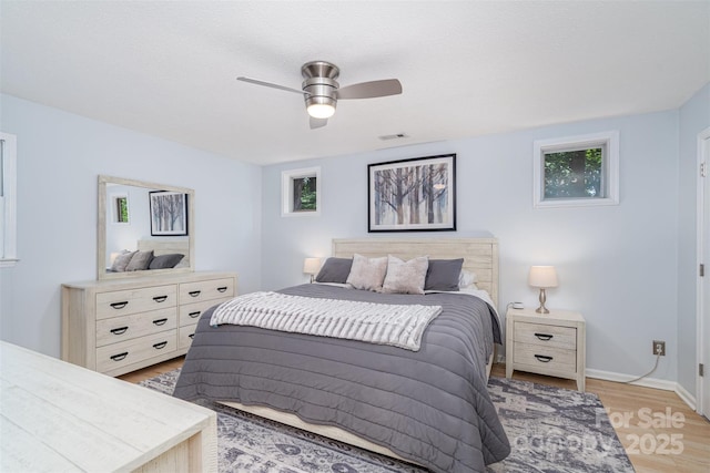 4725 Rounding Run Rd, Charlotte, NC 28277 - bedroom featuring light wood-style flooring, multiple windows, and a ceiling fan