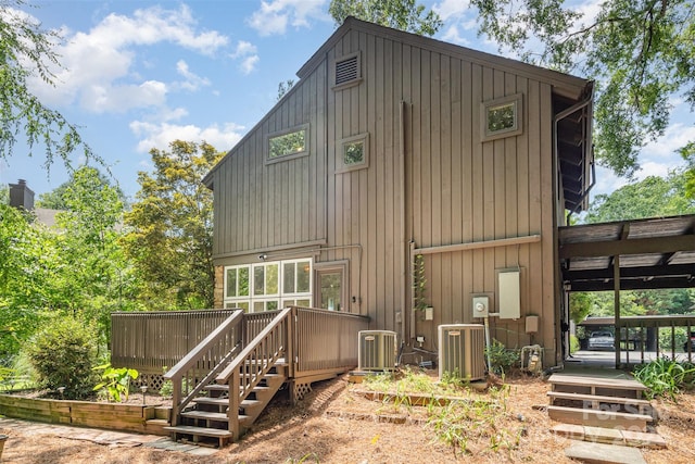 4725 Rounding Run Rd, Charlotte, NC 28277 - rear view of house featuring a wooden deck and board and batten siding