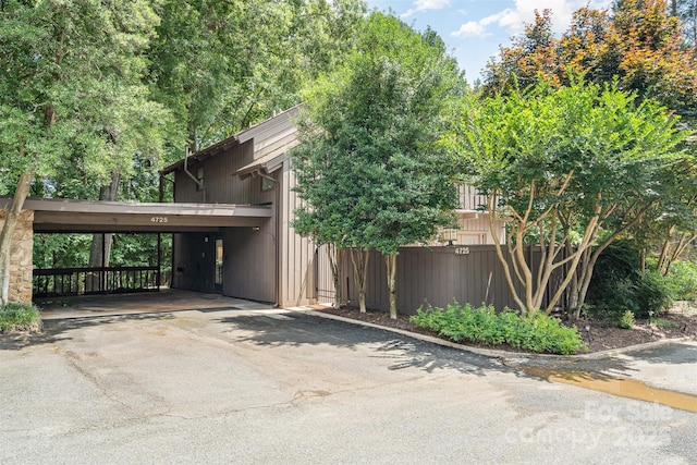 4725 Rounding Run Rd, Charlotte, NC 28277 - view of property exterior featuring covered parking