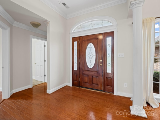 2872 Wheat Field Ct, Lincolnton, NC 28092 - foyer featuring wood finished floors, ornamental molding, ornate columns, and healthy amount of natural light