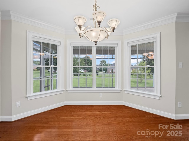 2872 Wheat Field Ct, Lincolnton, NC 28092 - unfurnished dining area with a chandelier, plenty of natural light, ornamental molding, and wood finished floors