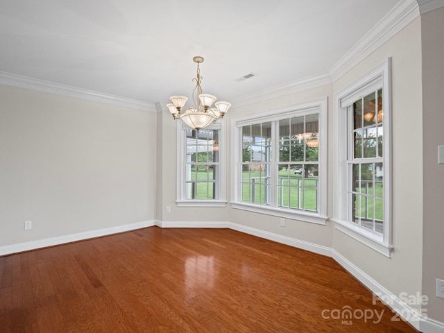 2872 Wheat Field Ct, Lincolnton, NC 28092 - spare room featuring a chandelier, wood finished floors, and ornamental molding