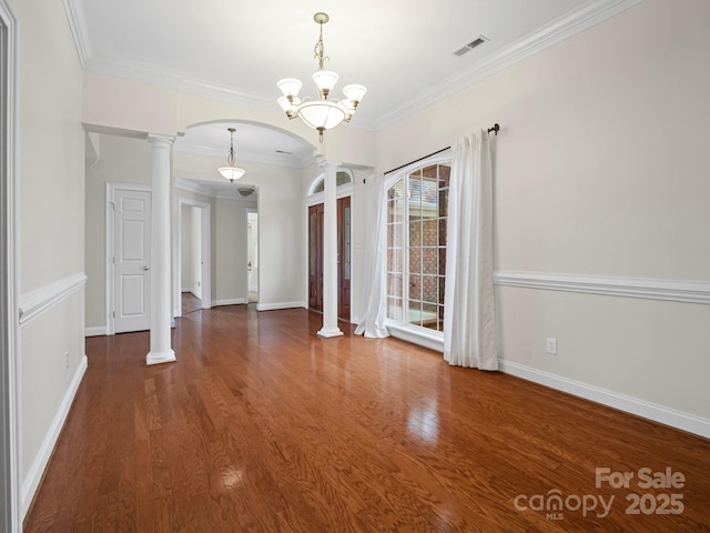 2872 Wheat Field Ct, Lincolnton, NC 28092 - unfurnished dining area featuring ornate columns, ornamental molding, a chandelier, arched walkways, and wood finished floors